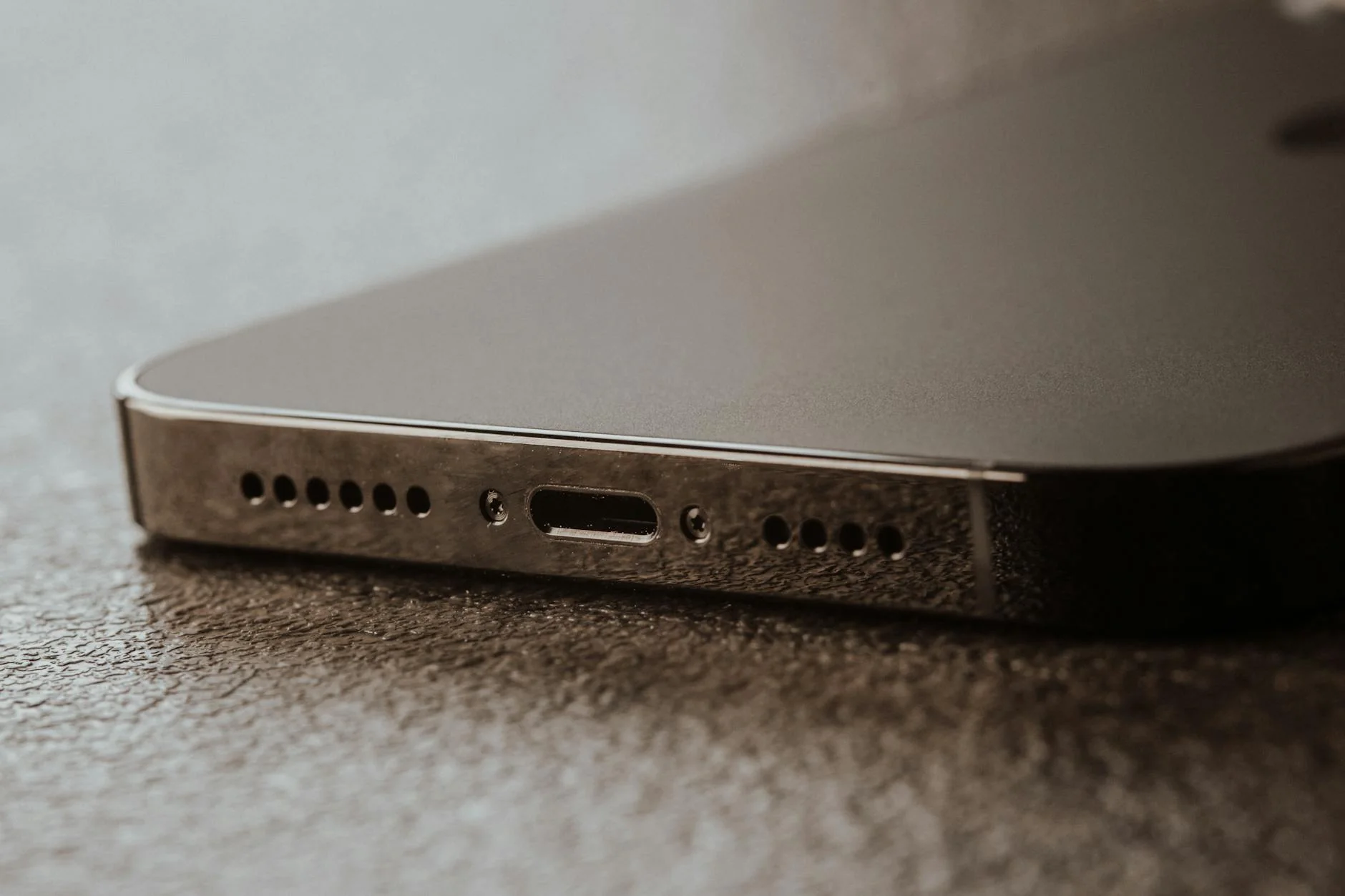 Close-up of a technician cleaning a charging port