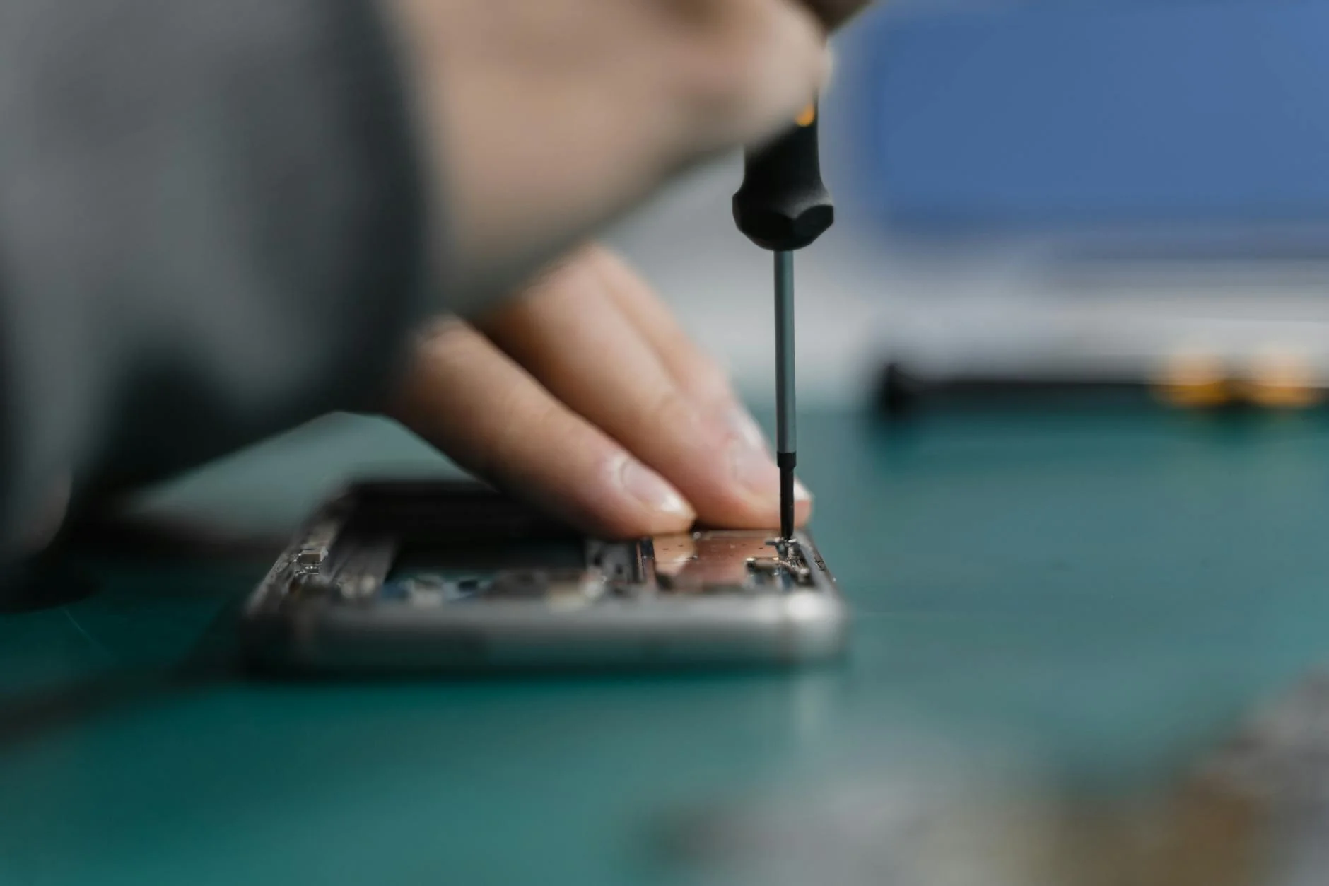 Technician replacing a phone screen